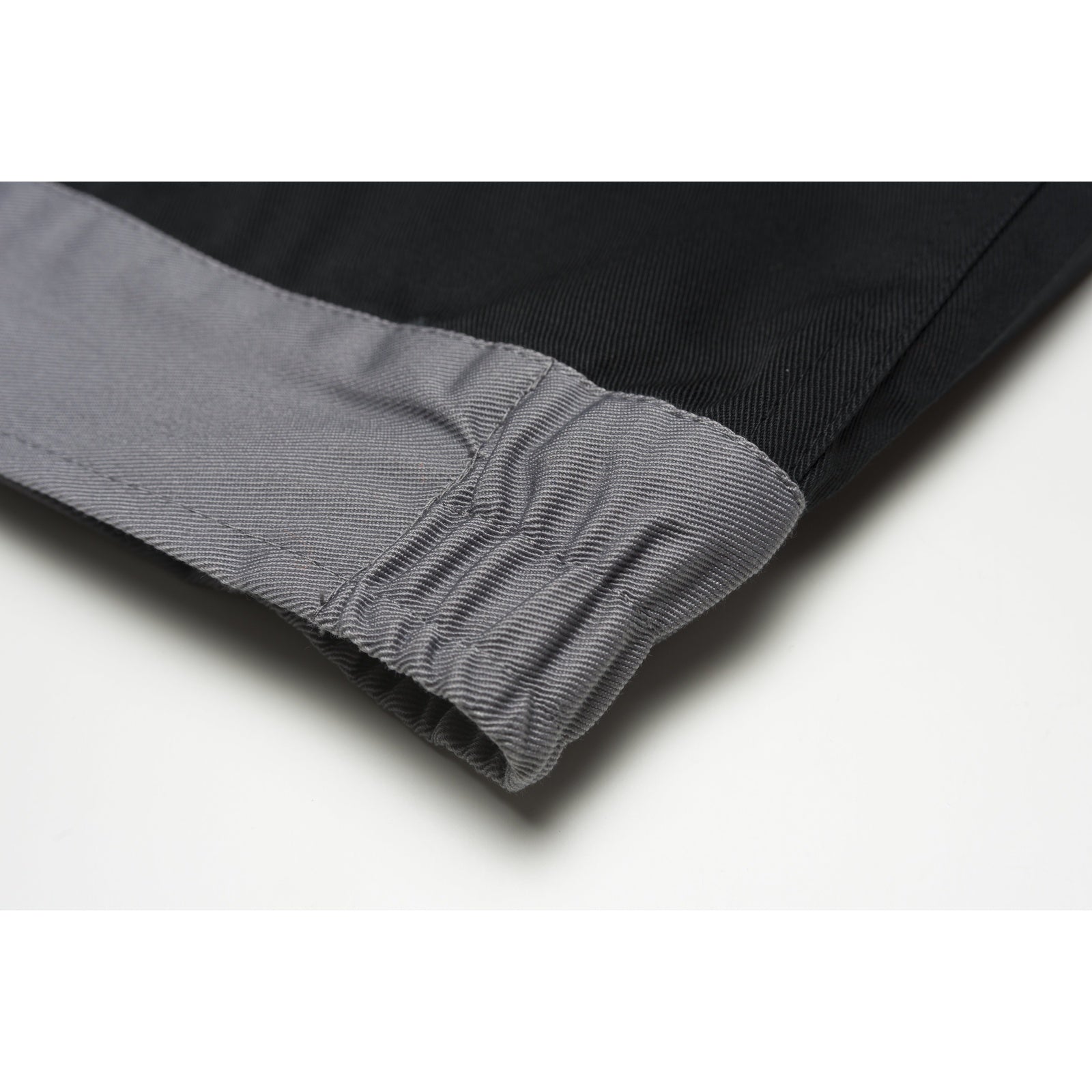 Planam Visline V1 Waisted Jacket black/orange/zinc - Greater freedom of movement thanks to the elastic in the waistband